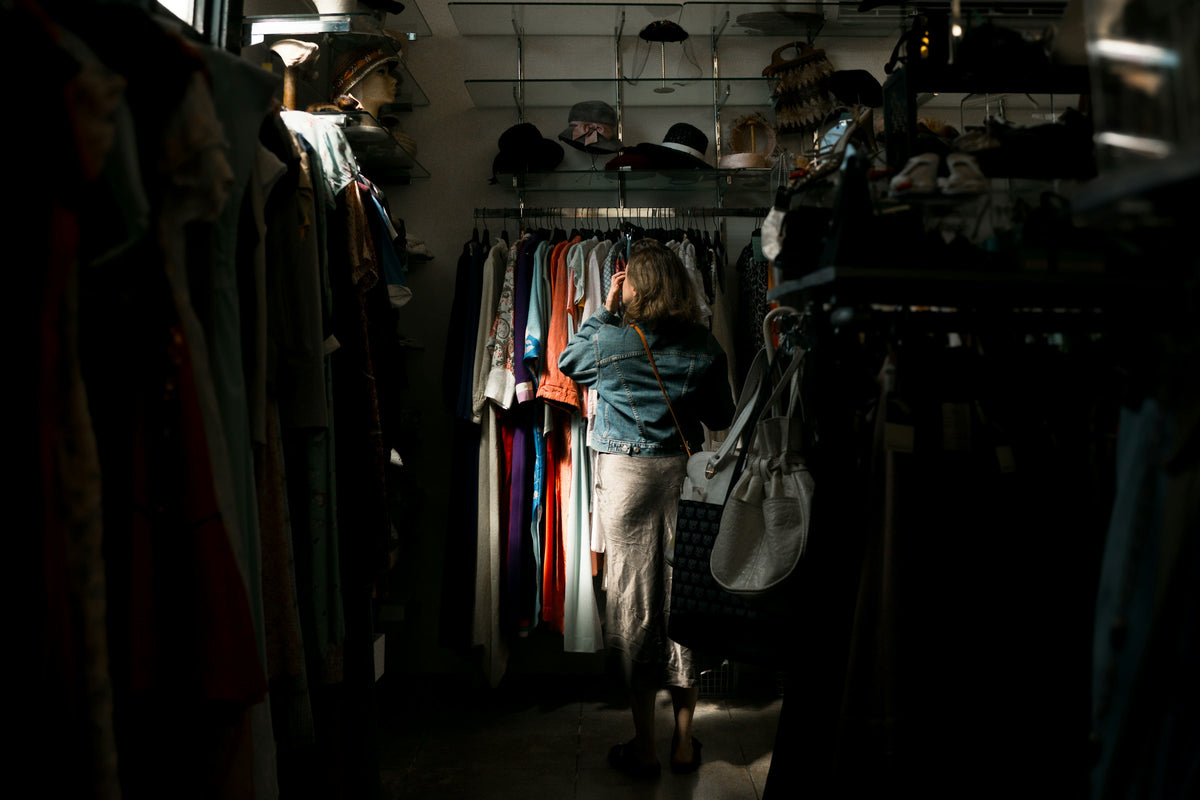 Woman browsing a clothes rack in a boutique